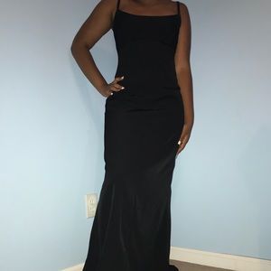 Black fitted evening gown.